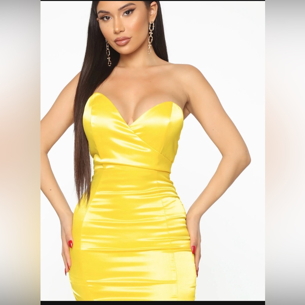 Yellow mini strapless satin dress with hidden back zipper.